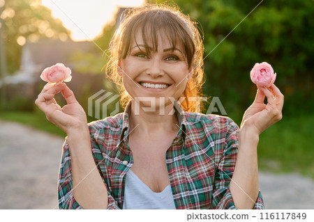 Happy positive smiling middle aged woman, outdoor portrait 116117849