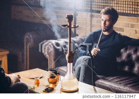 good looking man spending time at the bar 116117947