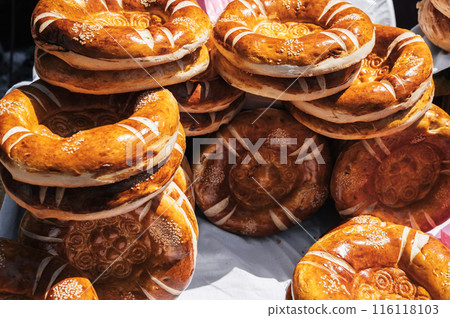 traditional Asian oriental flatbread Uzbek tandoor bread on the counter at bazaar in Uzbekistan 116118103