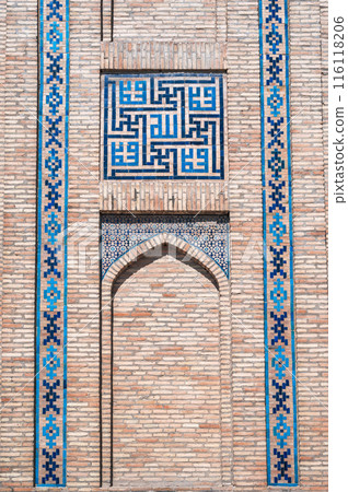 traditional Arabic Uzbek ceramic tile patterns on brick wall of the ancient Muslim Islamic Kukeldash Madrasah in Tashkent in Uzbekistan 116118206