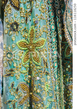 beaded embroidery on decorated traditional asian wedding dress close up beaded embroidery on decorated traditional asian wedding dress close up 116118250
