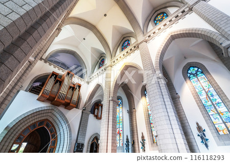 interior inside of Christian Catholic church with organ pipes on the wall. Sacred Heart of Jesus Cathedral in Tashkent in Uzbekistan 116118293