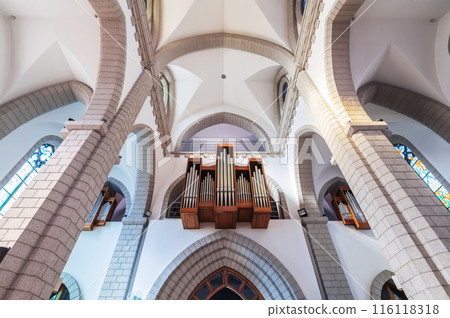 interior of Christian Catholic church with organ pipes on the wall. Sacred Heart of Jesus Cathedral in Tashkent in Uzbekistan interior of Christian Catholic church with organ pipes on the wall. Sacred Heart of Jesus Cathedral in Tashkent in Uzbekistan 116118318