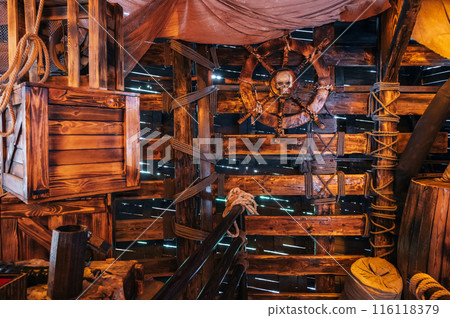 interior inside the wooden captain cabin on ancient medieval pirate ship interior inside the wooden captain cabin on ancient medieval pirate ship 116118379