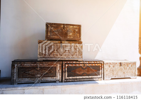 vintage traditional antique Uzbek handmade wooden chests with a pattern on metal lining on the street vintage traditional antique Uzbek handmade wooden chests with a pattern on metal lining on the street 116118415