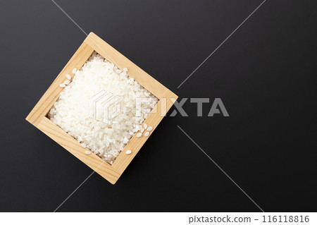White rice on a black background White rice on a black background 116118816