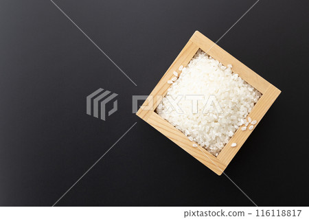 White rice on a black background 116118817