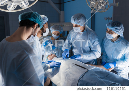 Surgeons perform a complex operation to save a human life at hospital 116119261
