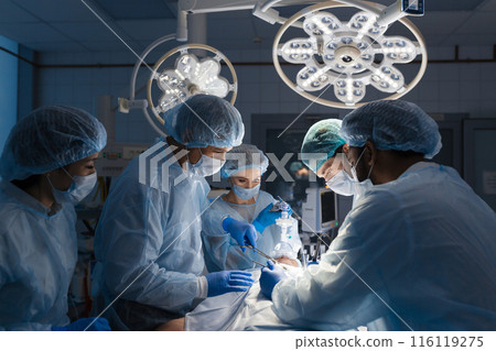 Surgeons perform a complex operation to save a human life at hospital Surgeons perform a complex operation to save a human life at hospital 116119275