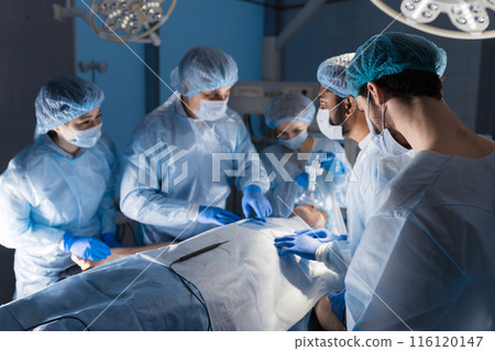 Surgeons perform a complex operation to save a human life at hospital 116120147