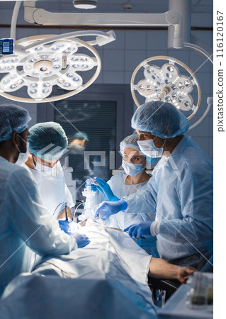 Surgeons perform a complex operation to save a human life at hospital Surgeons perform a complex operation to save a human life at hospital 116120167