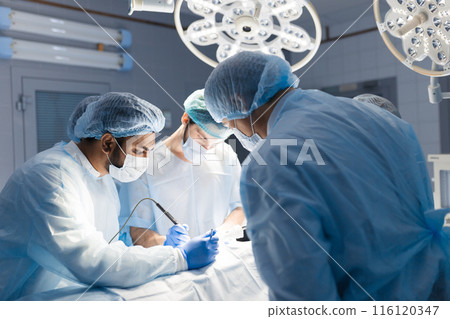 Team of Surgeons Operating in the Hospital 116120347