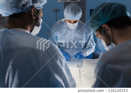 Surgeons perform a complex operation to save a human life at hospital 116120353