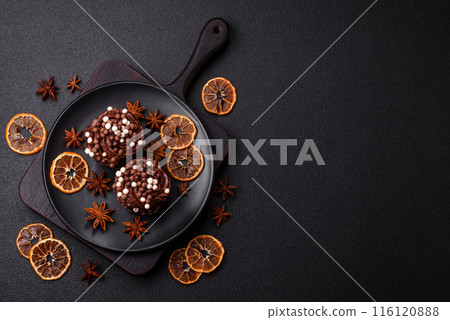 Delicious fresh muffins with filling and chocolate coating 116120888