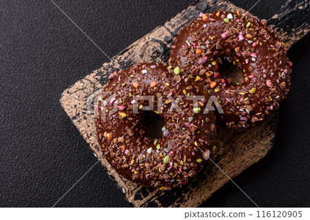 Delicious fresh donuts with filling and chocolate coating Delicious fresh donuts with filling and chocolate coating 116120905