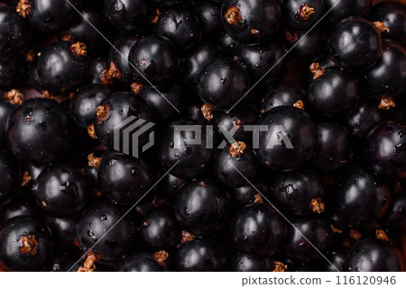 Ripe blackcurrant berries in droplets of water in a ceramic bowl Ripe blackcurrant berries in droplets of water in a ceramic bowl 116120946