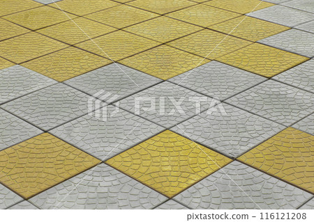 Diagonal pattern grey yellow paving slabs floor road surface street city background texture tile pavement urban 116121208