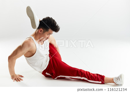 Asian man gymnastic warming up isolated studio on white background 116121234