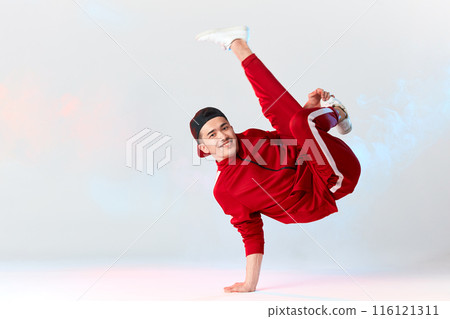 Asian personal break dancer trainer doing handstand on white background Asian personal break dancer trainer doing handstand on white background 116121311