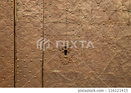 Old rusty door lock hole closeup. A keyhole in the old door. 116121415