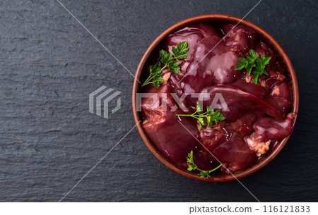 Raw chicken giblets liver, meat background. 116121833