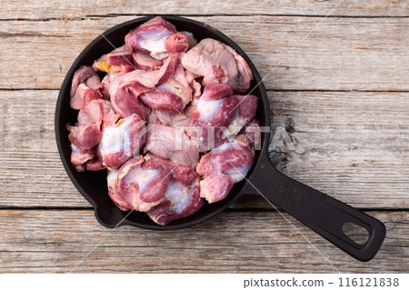 Raw chicken giblets gizzard ( stomach ) , meat background Raw chicken giblets gizzard ( stomach ) , meat background 116121838
