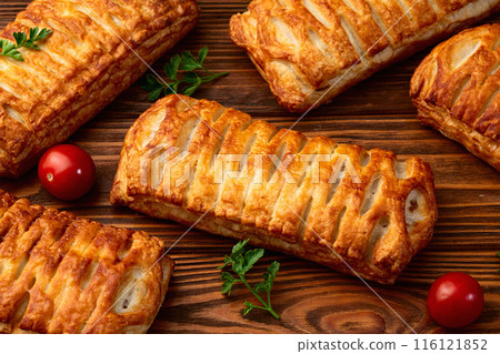 Golden Puff pastry stuffed with sausage and cheese 116121852