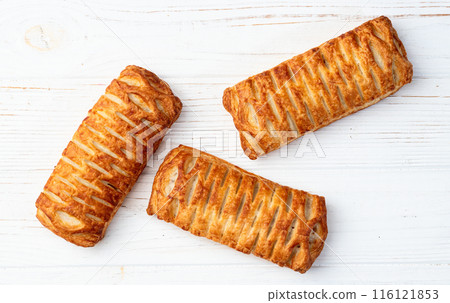 Golden Puff pastry stuffed with sausage and cheese 116121853
