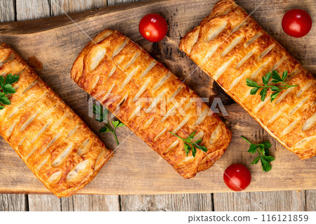 Golden Puff pastry stuffed with sausage and cheese 116121859