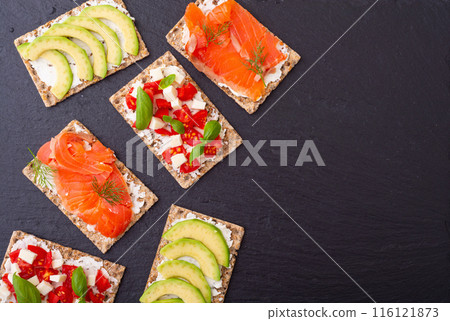 Protein toast ceispbread with delicious toppings top view Protein toast ceispbread with delicious toppings top view 116121873