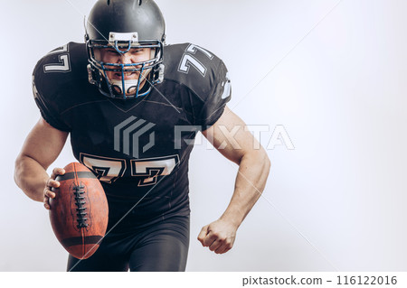 Quarterback throwing a football in a professional football game 116122016