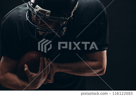 American football player with helmet and armour American football player with helmet and armour 116122083