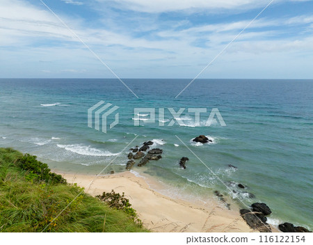 Beautiful waves crashing on rocks and white sand beach. Santa Fe, Tablas, Romblon. Philippines. Beautiful waves crashing on rocks and white sand beach. Santa Fe, Tablas, Romblon. Philippines. 116122154