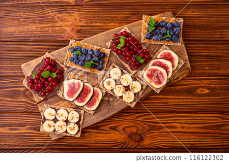 Protein toast crispbread with delicious toppings top view Protein toast crispbread with delicious toppings top view 116122302