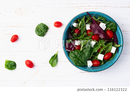 Summer salad with arugula, spinach, cherry tomatoes and cheese feta Summer salad with arugula, spinach, cherry tomatoes and cheese feta 116122322