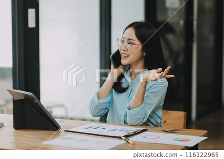 Asian woman working at the office. woman using laptop computer on desk at office 116122965
