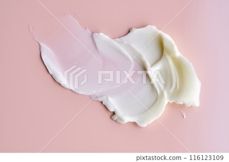 Texture of cosmetic butter on a pink background. Showcasing a thick and nourishing texture. 116123109
