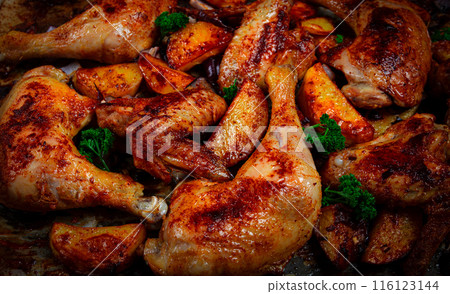 Roast chicken legs with potatoes and onions in the oven, homemade. No people. Roast chicken legs with potatoes and onions in the oven, homemade. No people. 116123144