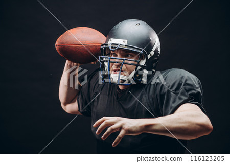 Quarterback throwing a football in a professional football game 116123205