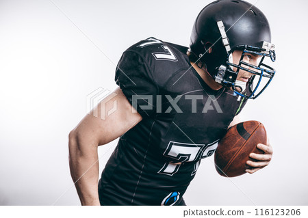 Quarterback throwing a football in a professional football game 116123206