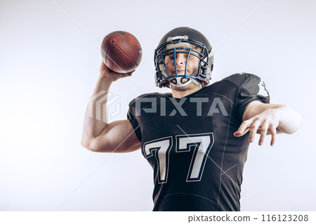 Quarterback throwing a football in a professional football game 116123208