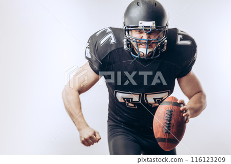 Quarterback throwing a football in a professional football game 116123209