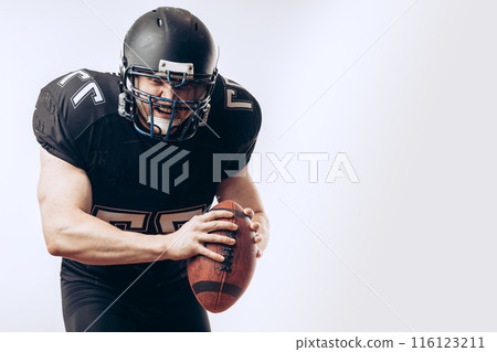Quarterback throwing a football in a professional football game Quarterback throwing a football in a professional football game 116123211