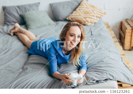 happy young woman having a rest on the bed happy young woman having a rest on the bed 116123261