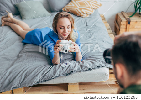 crazy photographers having fun indoors crazy photographers having fun indoors 116123263