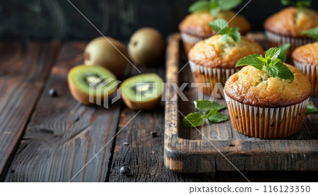 Fresh Kiwi Muffins on Rustic Wooden Table Fresh Kiwi Muffins on Rustic Wooden Table 116123350
