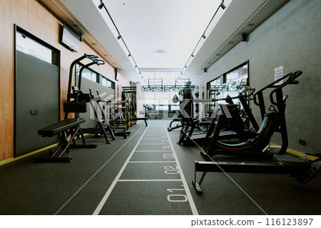 Low angle shot of equipped room of premium fitness club, room full of sport equipment 116123897