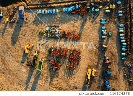 Aerial View of Multiple Rows of Tractors in a Georgia Field Aerial View of Multiple Rows of Tractors in a Georgia Field 116124278