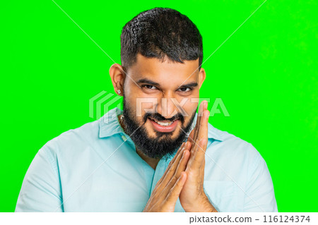 Sneaky cunning Indian young man thinking over devious villain idea, cheats, jokes, pranks, evil plan Sneaky cunning Indian young man thinking over devious villain idea, cheats, jokes, pranks, evil plan 116124374