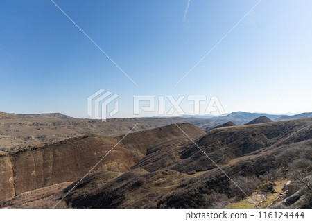 Majestic Mountain Range Under Clear Blue Sky 116124444